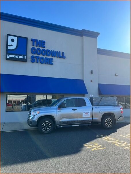 The ExtraHands ASAP pickup truck parked outside a Goodwill donation centre