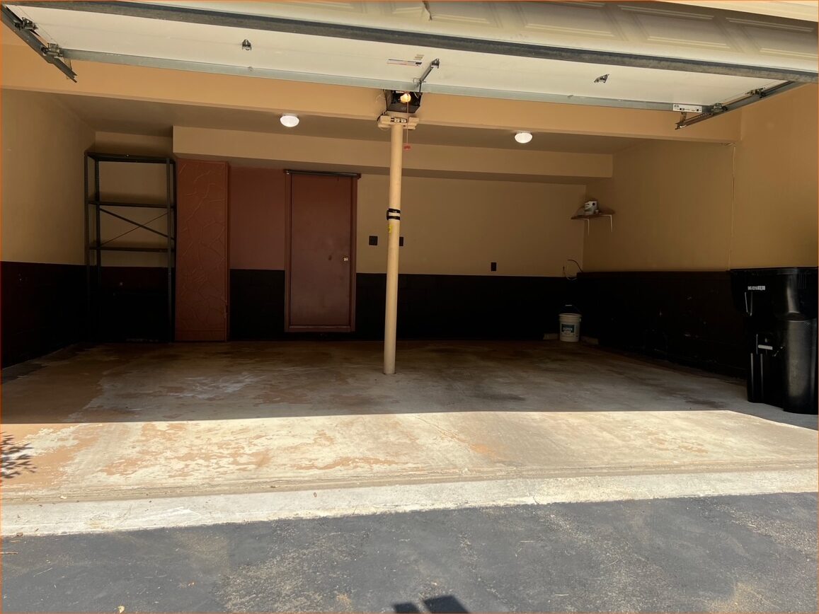 The same garage completely empty and swept clean