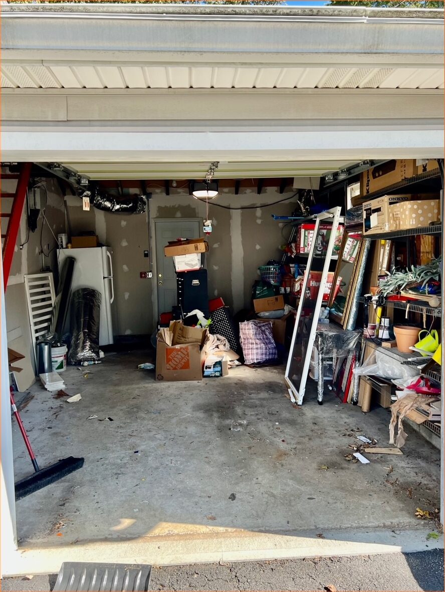Garage packed with furniture and boxes
